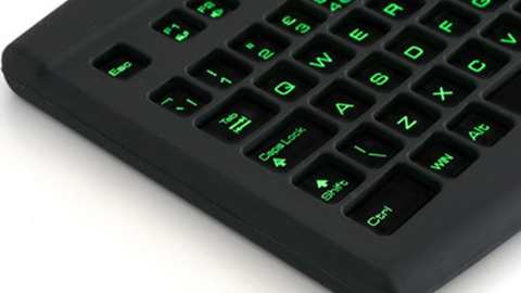 A close-up of the keyboard. The keys are lit green.